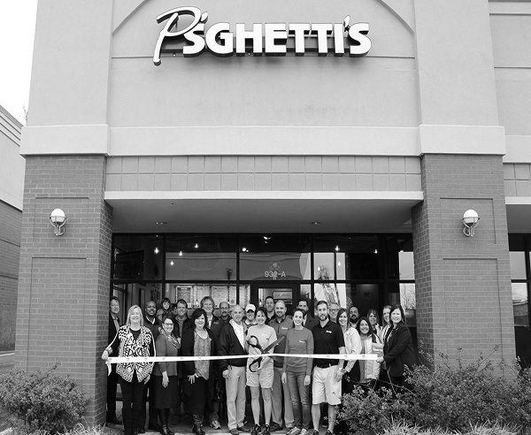Psghettis crew in front of store ribbon cutting